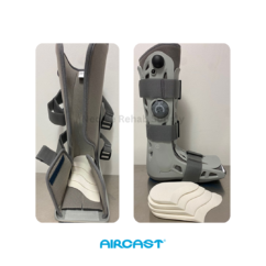 Aircast walking boot fitted with Achilles heel wedges for adjustable foot positioning and post-surgery tendon rehabilitation support.