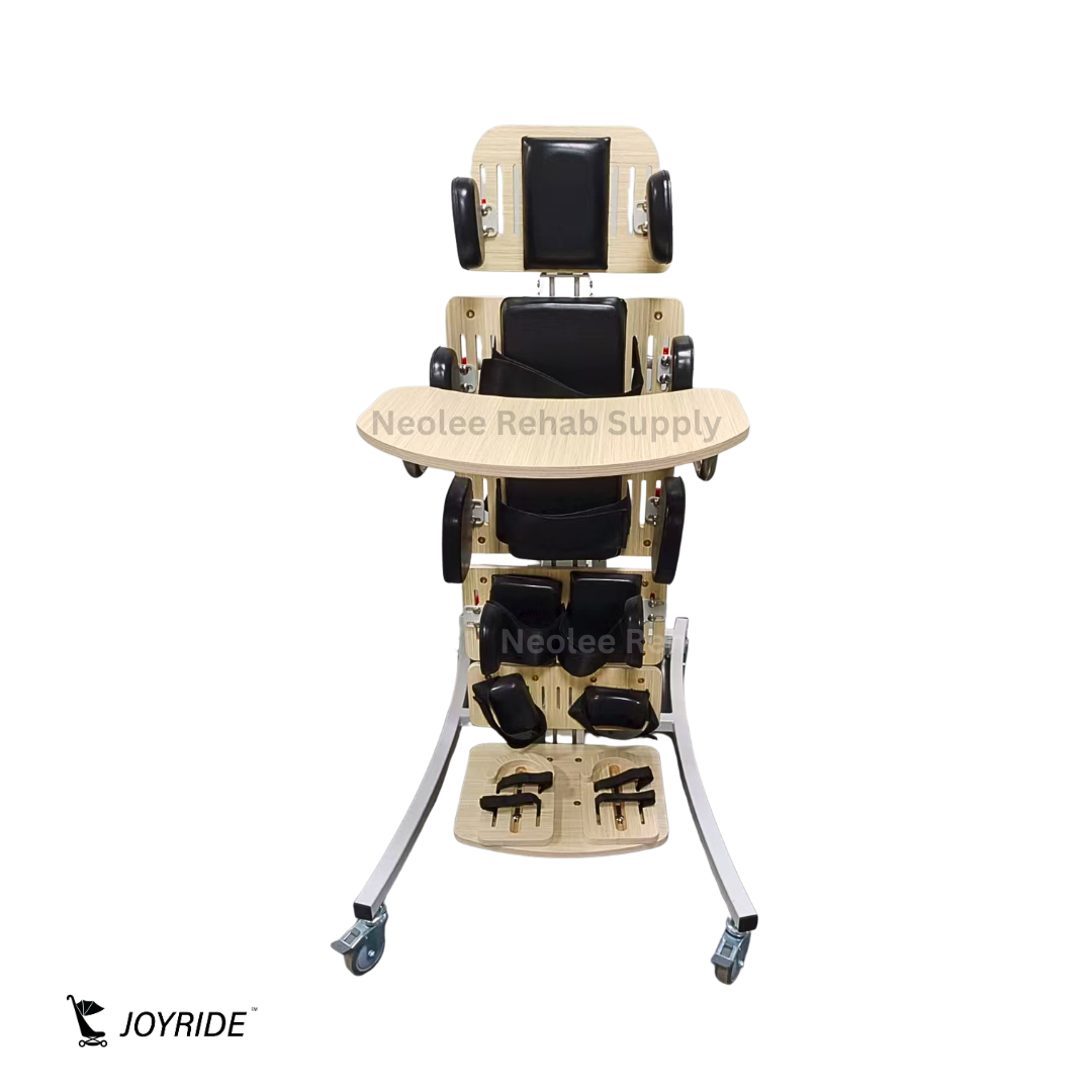 Front view of Joyride pediatric supine standing frame featuring adjustable headrest, padded supports, therapy tray, and lockable caster wheels.